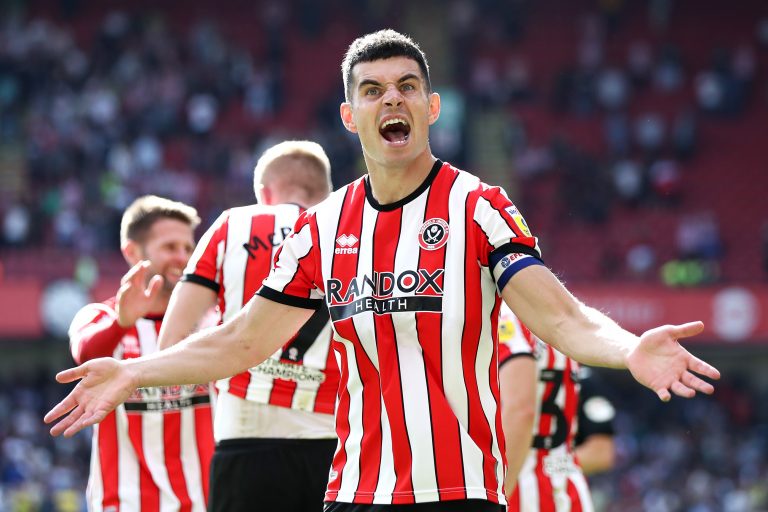Sheffield-United-captain-John-Egan-celebrates-a-goal-scored-by-teammate-Iliman-Ndiaye