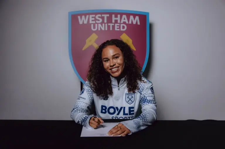 Ebony Salmon posing in a West Ham United shirt after signing for the Women's team